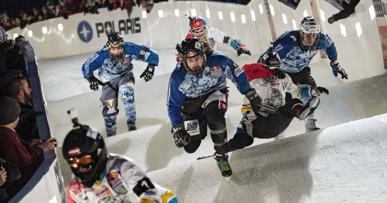 Team members of Couch Garden Crew compete with Ice Crew during the Team Competition of the 2015 Ice Cross Downhill World Championship at Red Bull Crashed Ice in Saint Paul, United States on January 23, 2015.